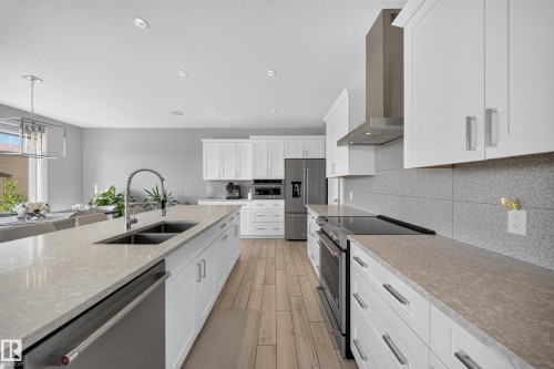 7640 179 Avenue Nw, Edmonton, AB - Indoor Photo Showing Kitchen With Stainless Steel Kitchen With Double Sink With Upgraded Kitchen