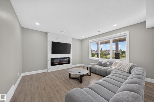 7640 179 Avenue Nw, Edmonton, AB - Indoor Photo Showing Living Room With Fireplace