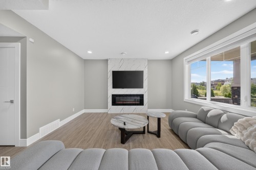 7640 179 Avenue Nw, Edmonton, AB - Indoor Photo Showing Living Room With Fireplace