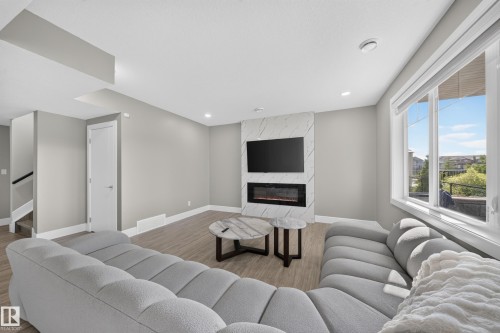 7640 179 Avenue Nw, Edmonton, AB - Indoor Photo Showing Living Room With Fireplace