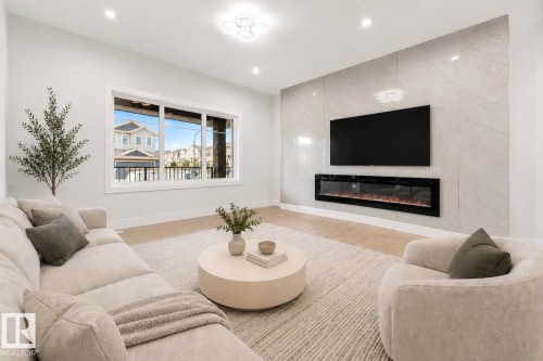 352 Roberts Wynd, Leduc, AB - Indoor Photo Showing Living Room With Fireplace