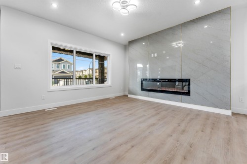 352 Roberts Wynd, Leduc, AB - Indoor Photo Showing Living Room With Fireplace