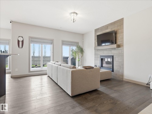 2115 Auxier Court Sw, Edmonton, AB - Indoor Photo Showing Living Room With Fireplace