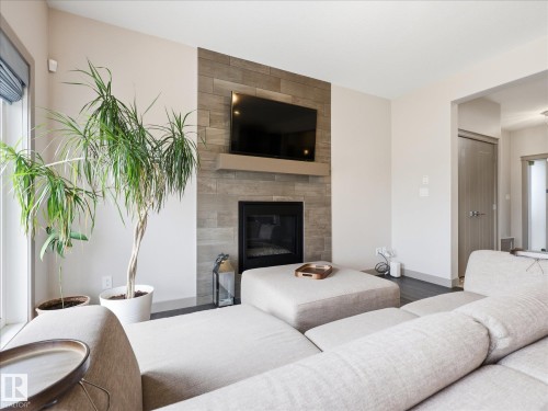 2115 Auxier Court Sw, Edmonton, AB - Indoor Photo Showing Other Room With Fireplace