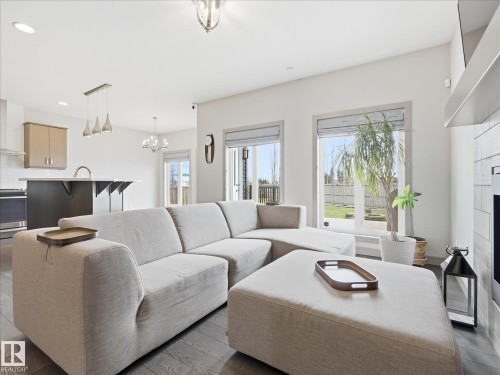 2115 Auxier Court Sw, Edmonton, AB - Indoor Photo Showing Living Room With Fireplace