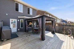 Expansive wood deck featuring a covered gazebo - 