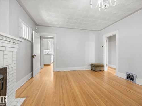 11331 66 Street Nw, Edmonton, AB - Indoor Photo Showing Other Room With Fireplace