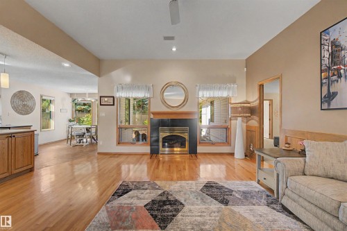 711 Butterworth Drive Nw, Edmonton, AB - Indoor Photo Showing Living Room With Fireplace