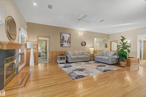 711 Butterworth Drive Nw, Edmonton, AB - Indoor Photo Showing Living Room With Fireplace