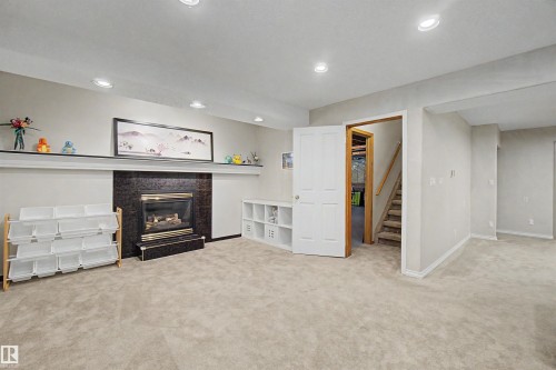 711 Butterworth Drive Nw, Edmonton, AB - Indoor With Fireplace