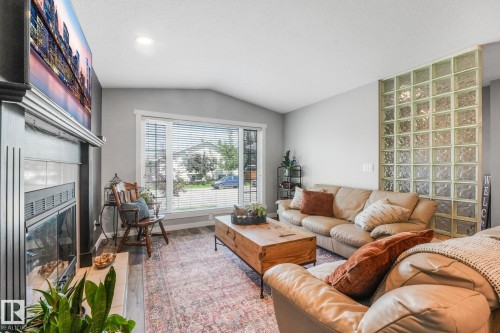 5809 48 Avenue, Beaumont, AB - Indoor Photo Showing Living Room With Fireplace