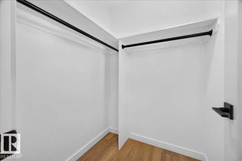 Primary bedroom walk-in closet - 11604 35 Avenue Nw, Edmonton, AB - Indoor Photo Showing Other Room