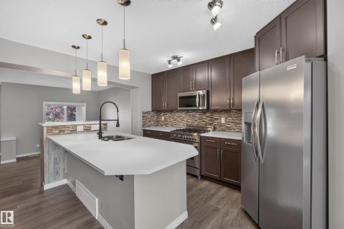 Kitchen - 3139 Carpenter Landing Sw, Edmonton, AB - Indoor Photo Showing Kitchen With Stainless Steel Kitchen With Double Sink With Upgraded Kitchen