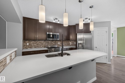 Kitchen - 3139 Carpenter Landing Sw, Edmonton, AB - Indoor Photo Showing Kitchen With Stainless Steel Kitchen With Double Sink With Upgraded Kitchen