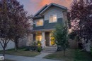 Two-story residence featuring a covered front porch, vertical siding, horizontal siding, and shake siding in a multi-tone color scheme - 3139 Carpenter Landing Sw, Edmonton, AB  - Outdoor 