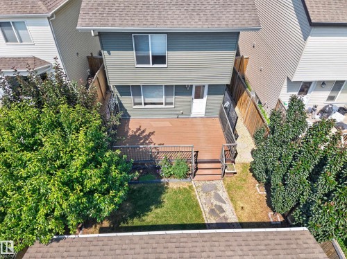 Green siding exterior with a brown shingle roof - 3139 Carpenter Landing Sw, Edmonton, AB - Outdoor With Exterior
