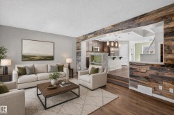 Reclaimed wood accent wall and flooring define this living space - 