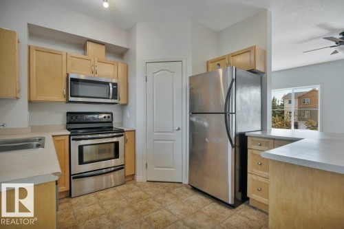 #142 104 West Haven Dr, Leduc, AB - Indoor Photo Showing Kitchen With Double Sink