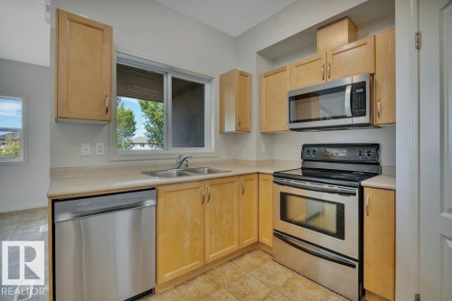 #142 104 West Haven Dr, Leduc, AB - Indoor Photo Showing Kitchen With Double Sink