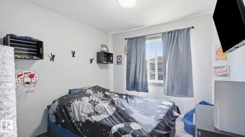 #18 4900 62 St, Beaumont, AB - Indoor Photo Showing Bedroom