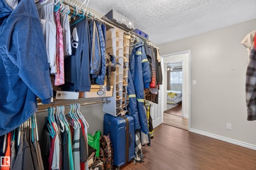 Closet space featuring wire shelving and hanging rods - 8310 99 Avenue, Fort Saskatchewan, AB - Indoor With Storage