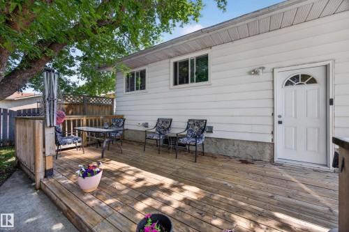 Expansive wood deck with a partial privacy fence - 8310 99 Avenue, Fort Saskatchewan, AB - Outdoor With Deck Patio Veranda With Exterior