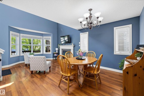 44 Vaughn Avenue, Spruce Grove, AB - Indoor Photo Showing Dining Room With Fireplace