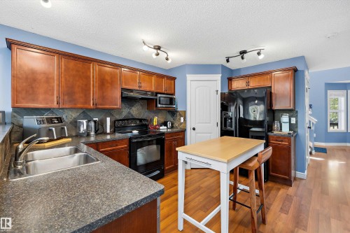 44 Vaughn Avenue, Spruce Grove, AB - Indoor Photo Showing Kitchen With Double Sink