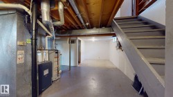 Unfinished basement offering ample storage potential - 