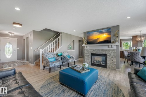 96 Marcelle Point(E), Beaumont, AB - Indoor Photo Showing Living Room With Fireplace