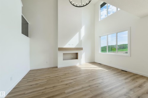 1309 Hawks Ridge Link Nw, Edmonton, AB - Indoor Photo Showing Other Room With Fireplace