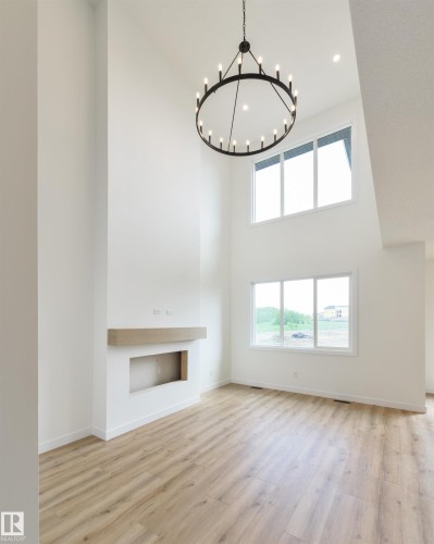 1309 Hawks Ridge Link Nw, Edmonton, AB - Indoor Photo Showing Other Room With Fireplace