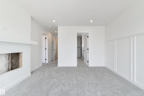 1309 Hawks Ridge Link Nw, Edmonton, AB - Indoor Photo Showing Other Room With Fireplace
