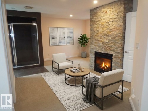 #141 102 West Haven Dr, Leduc, AB - Indoor Photo Showing Other Room With Fireplace