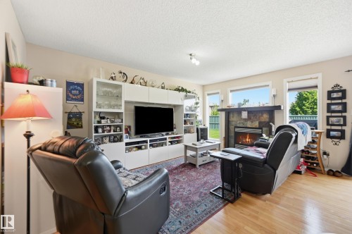 1867 119 Street Sw, Edmonton, AB - Indoor Photo Showing Living Room With Fireplace