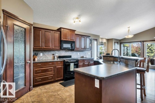48 Lamplight Drive, Spruce Grove, AB - Indoor Photo Showing Kitchen With Double Sink