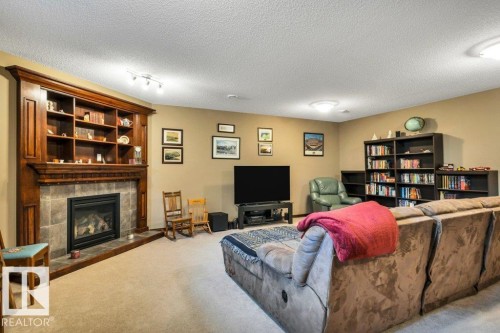48 Lamplight Drive, Spruce Grove, AB - Indoor With Fireplace