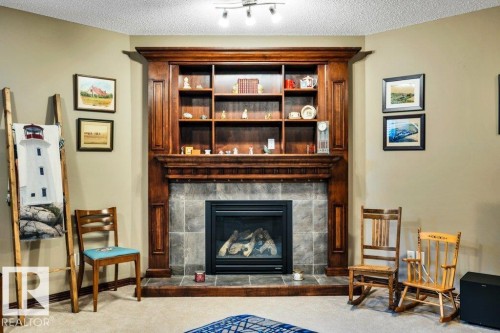 48 Lamplight Drive, Spruce Grove, AB - Indoor Photo Showing Living Room With Fireplace