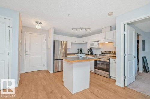 #217 245 Edwards Dr Sw, Edmonton, AB - Indoor Photo Showing Kitchen With Stainless Steel Kitchen