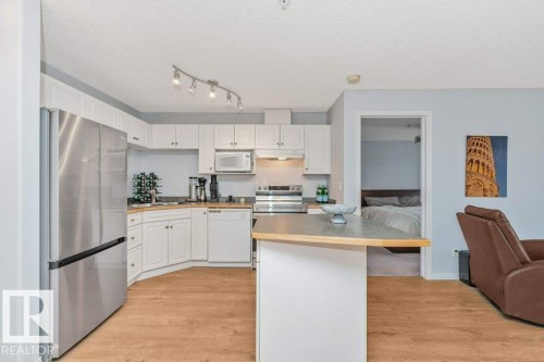 #217 245 Edwards Dr Sw, Edmonton, AB - Indoor Photo Showing Kitchen With Stainless Steel Kitchen With Double Sink