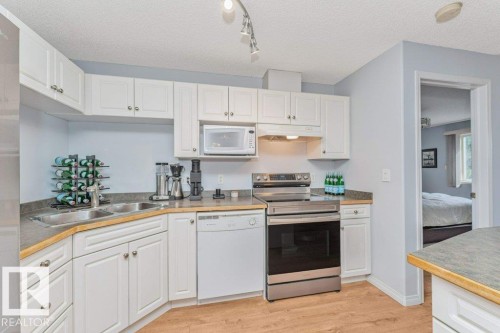 #217 245 Edwards Dr Sw, Edmonton, AB - Indoor Photo Showing Kitchen With Double Sink