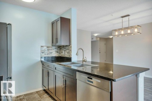 #201 534 Watt Bv Sw, Edmonton, AB - Indoor Photo Showing Kitchen With Double Sink With Upgraded Kitchen