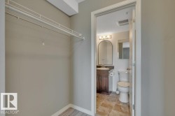 Walk-through closet with to the ensuite with a large walk-in shower. - 