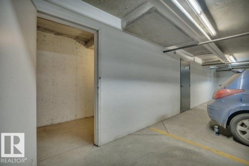 Storage room, completely enclosed at the front of underground parking stall - #178 - #201 534 Watt Bv Sw, Edmonton, AB - Indoor Photo Showing Garage