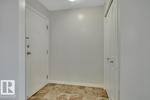 Spacious entry with coat closet. - #201 534 Watt Bv Sw, Edmonton, AB - Indoor Photo Showing Other Room
