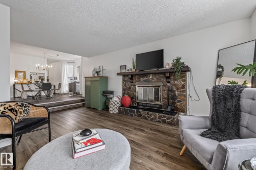 #201 10743 107 St Nw, Edmonton, AB - Indoor Photo Showing Living Room With Fireplace