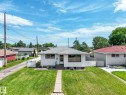 White siding exterior with black-trimmed windows - 13323 58 Street Nw, Edmonton, AB  - Outdoor 