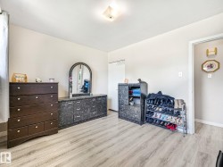 Light wood-finish flooring extending throughout the room - 