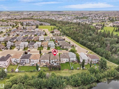 Aerial perspective showcasing a residential neighborhood with varied housing styles - 3136 35 Avenue Nw, Edmonton, AB - Outdoor With View