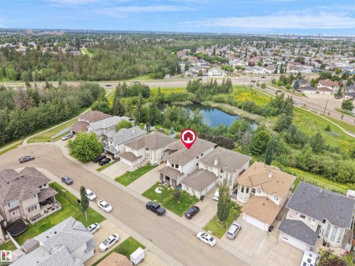Aerial perspective featuring a residential street with homes showcasing varied architectural styles and rooflines - 3136 35 Avenue Nw, Edmonton, AB - Outdoor With View